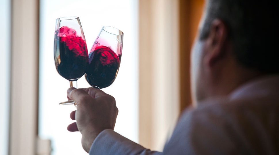 Man swirling port at Graham's Port winery
